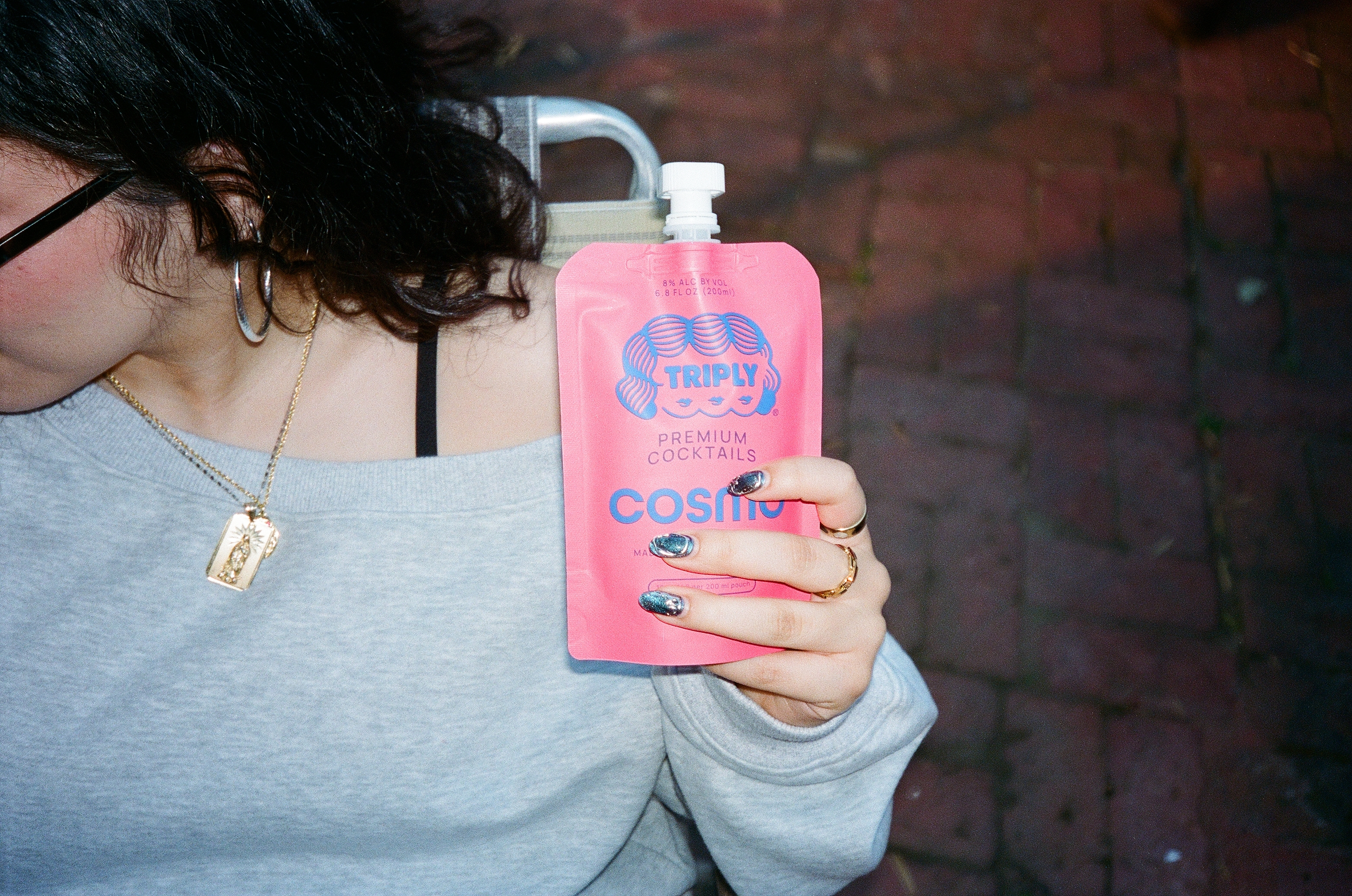 Customer holding a Triply Cosmo pouch