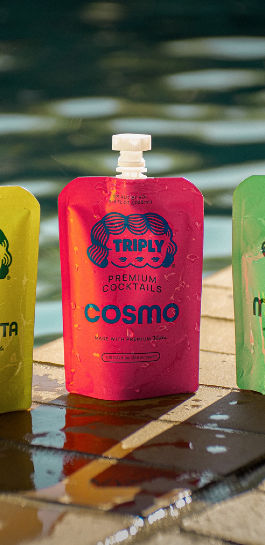 Three Triply cocktail pouches by the pool